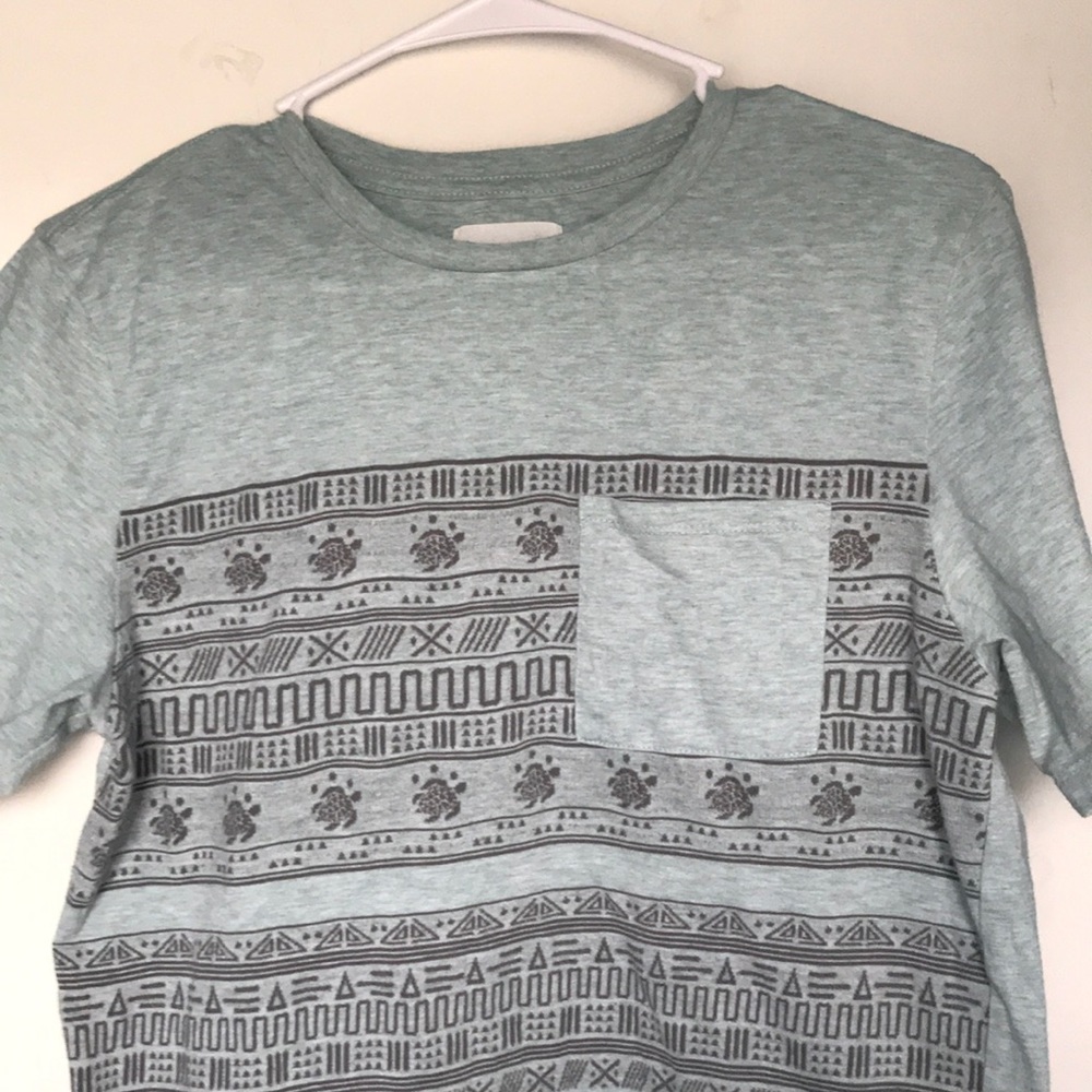 Teal On The Byas Turtle Print Tee.